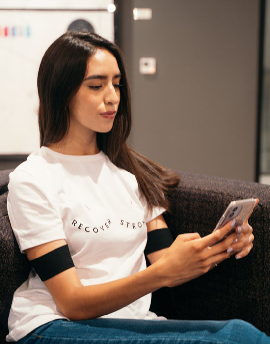 woman using phone and she rex band